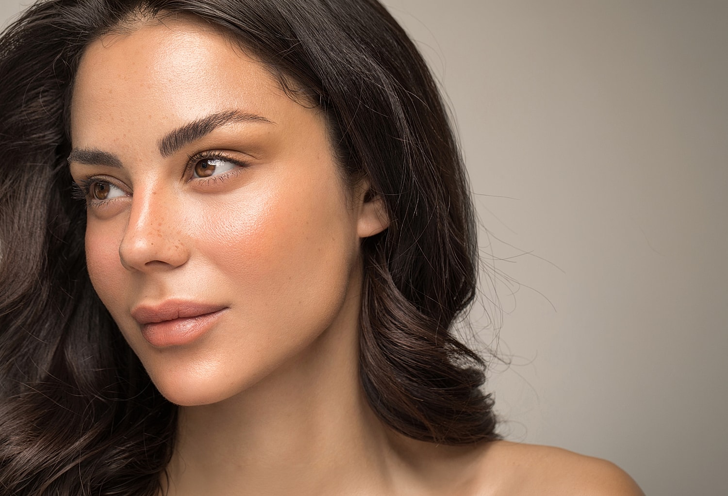 Close-up portrait of a woman with natural beauty.