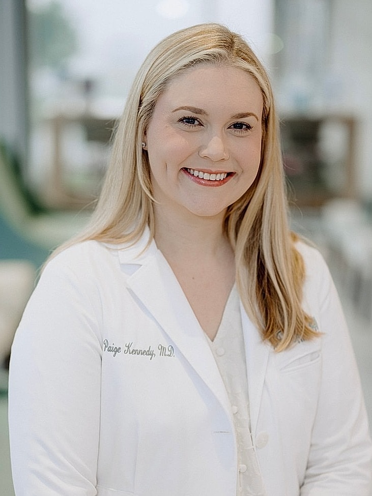Smiling doctor in white coat portrait.