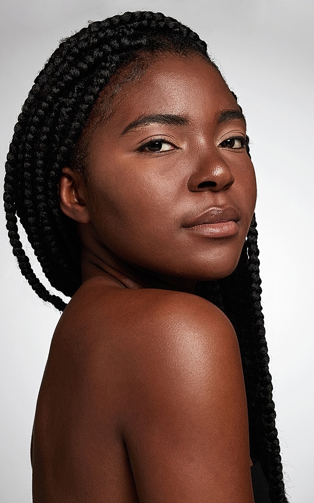 Portrait of a woman with braided hair.